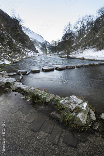 River flowing through snow ...