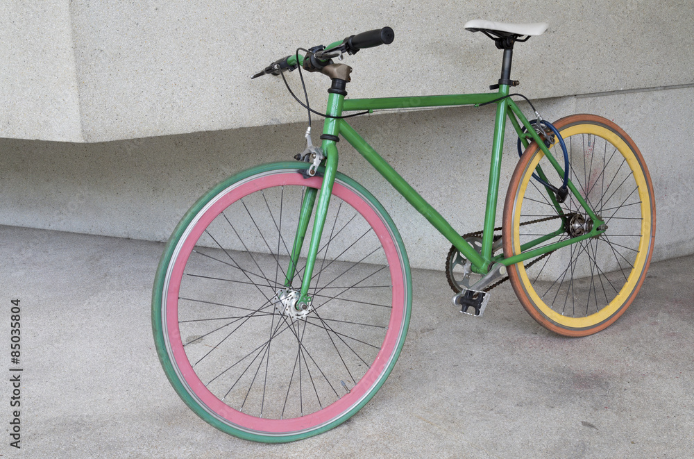 green fixed gear bicycle at building green fixed gear bicycle at building