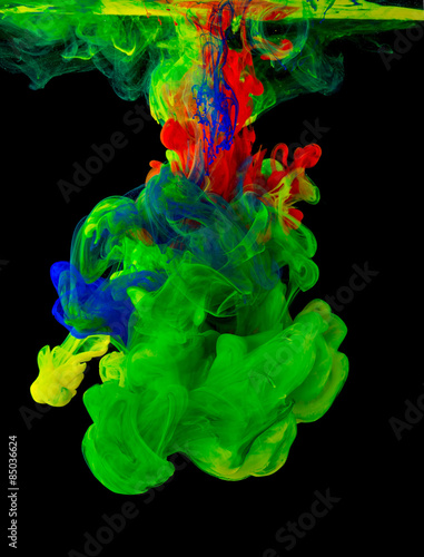 Colored ink isolated on black background