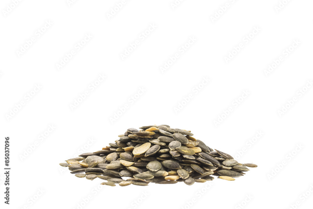 Pile of pumpkin seeds isolated on white background Pile of pumpkin seeds isolated on white background
