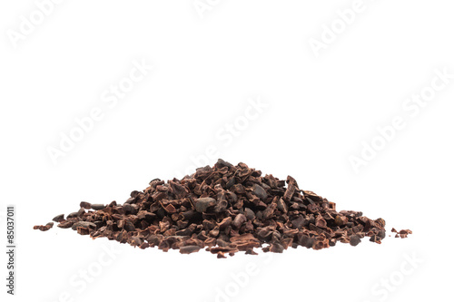 Raw organic cacao nibs isolated on white