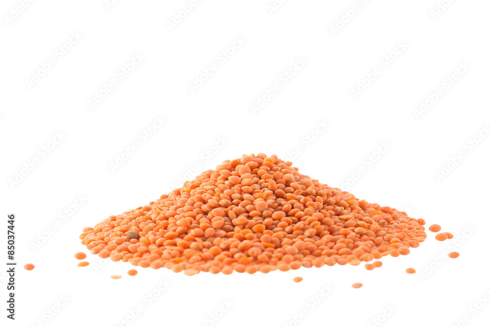 Heap of raw red lentils isolated on white Heap of raw red lentils isolated on white