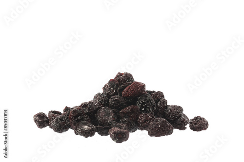Pile of dried dark cherries isolated