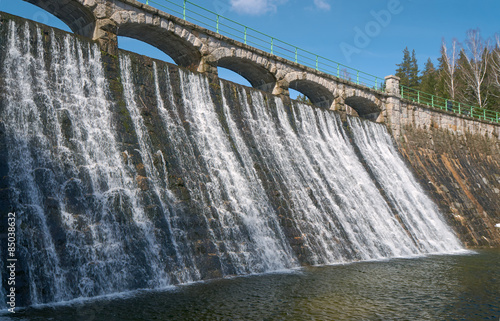 The dam and waterfall on the river Åomnica in Karpacz.