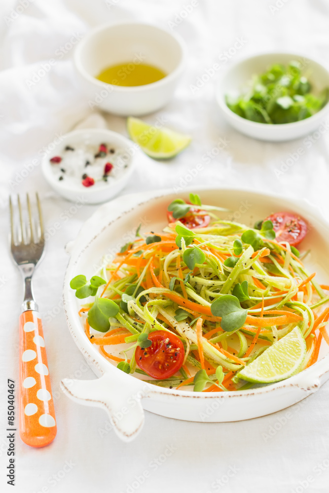 fresh salad with zucchini and carrots in a vintage plate fresh salad with zucchini and carrots in a vintage plate