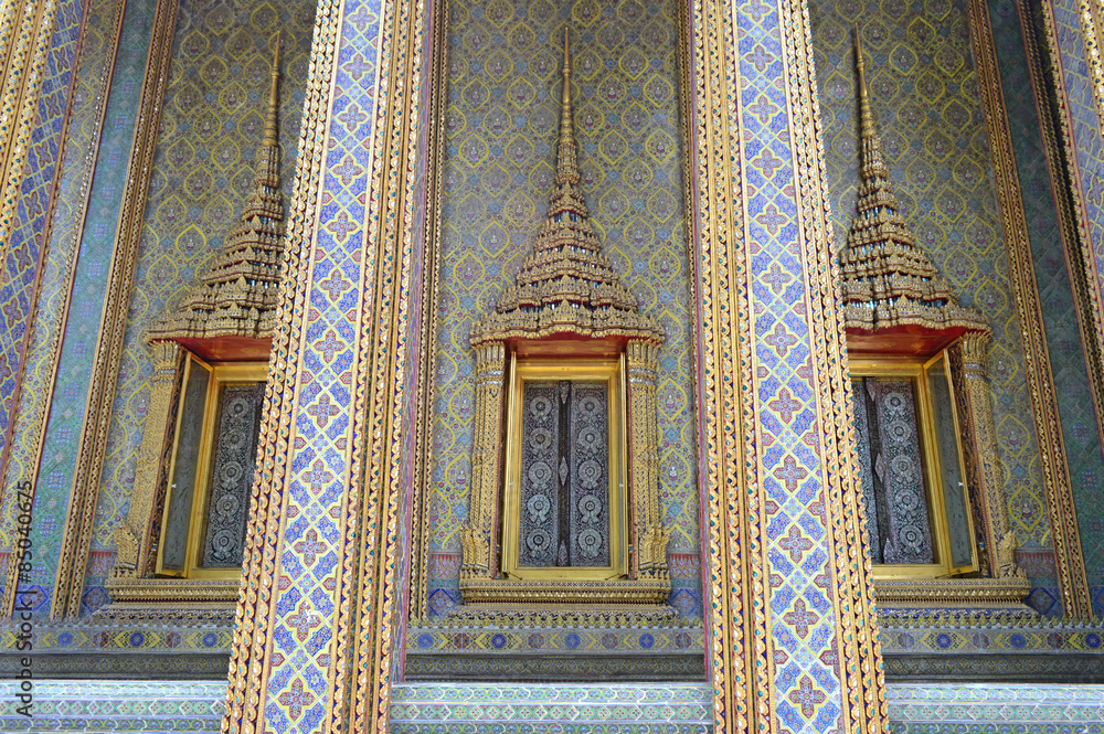 Thai style pattern wall and windows at Wat Ratchabophit, Bangkok, Thailand