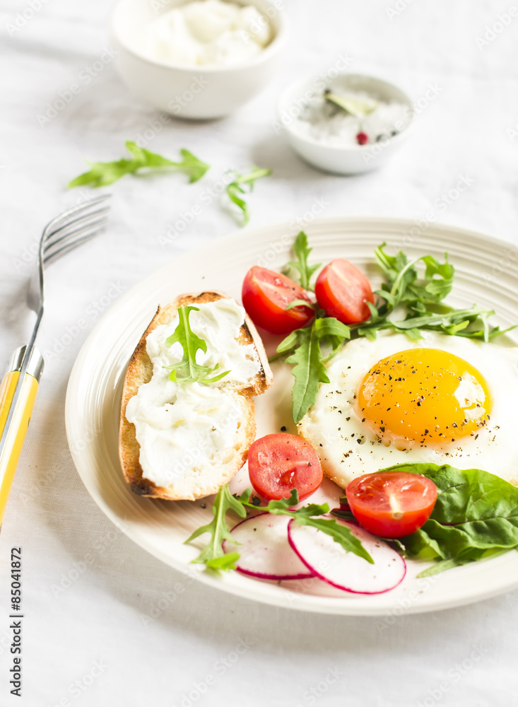 fried egg, vegetable salad and a grilled cheese sandwich 