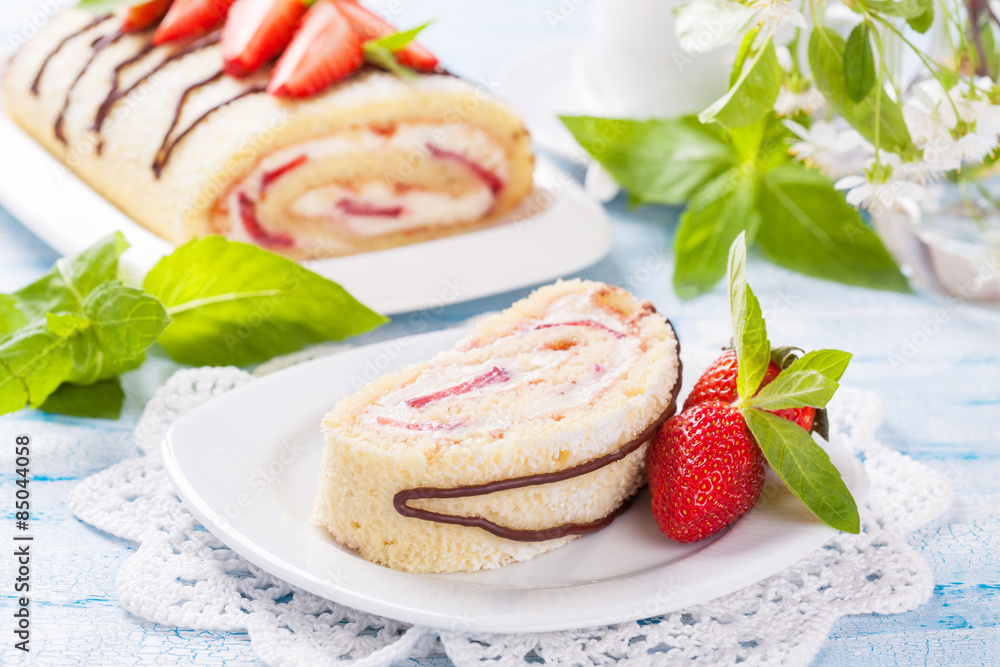 Homemade sponge roll with strawberries and mascarpone cream Homemade sponge roll with strawberries and mascarpone cream
