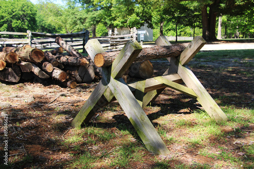The old wooden sawhorse on the summer country farm scene