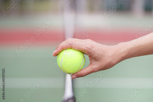 Tennis ball on the net © tatomm