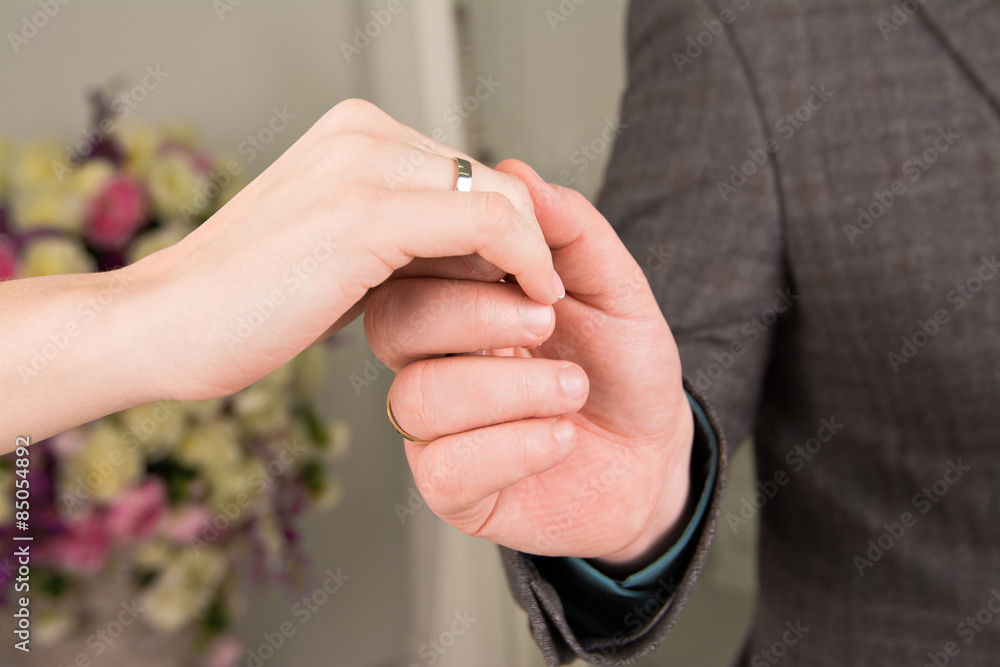 man holding the hand of his woman