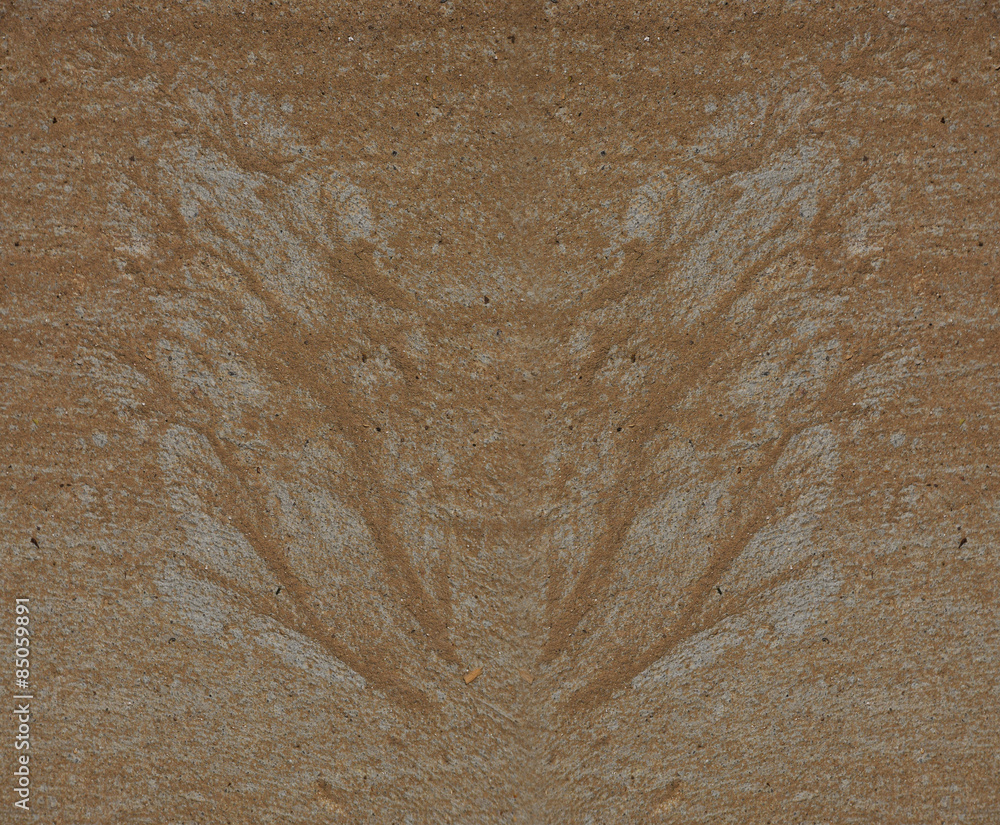 Silhouette of butterfly wings made of sand and gravel by water flow at concrete surface Silhouette of butterfly wings made of sand and gravel by water flow at concrete surface