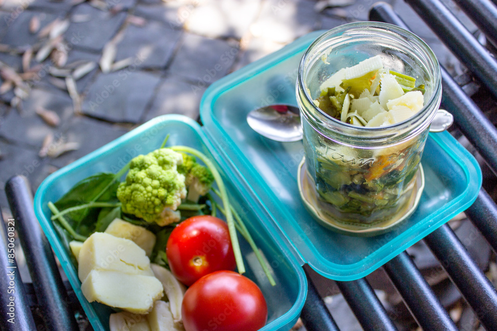Refreshments / Box with a healthy lunch on a bench Refreshments / Box with a healthy lunch on a bench