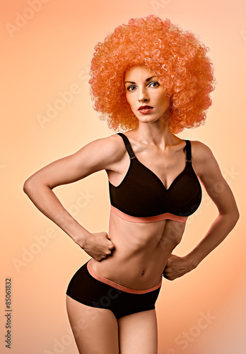 Strong fitness woman, pose hands into fists, vintage style