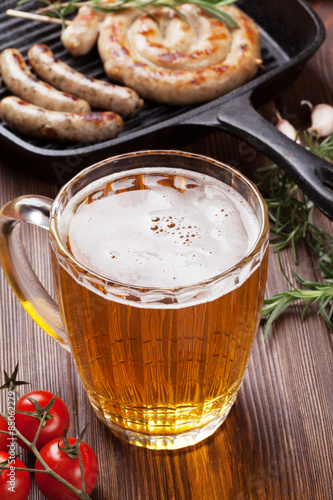 Beer mug and grilled sausages