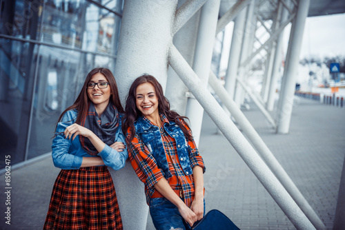 Girls having fun and happy when they met at the airport.Art proc