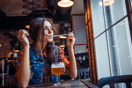 Canvas-taulu Beer woman enjoying a fresh draft beer on cafe. Art processing a