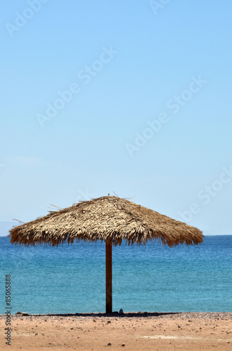 Fototapeta Naklejka Na Ścianę i Meble -  Straw Beach Umbrella