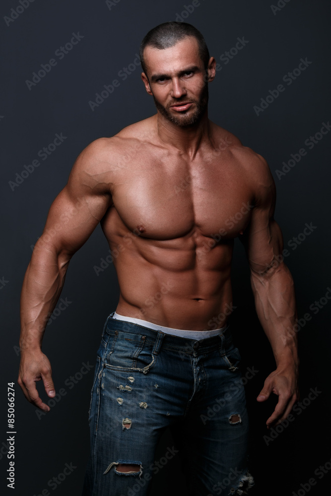 Handsome muscular man posing