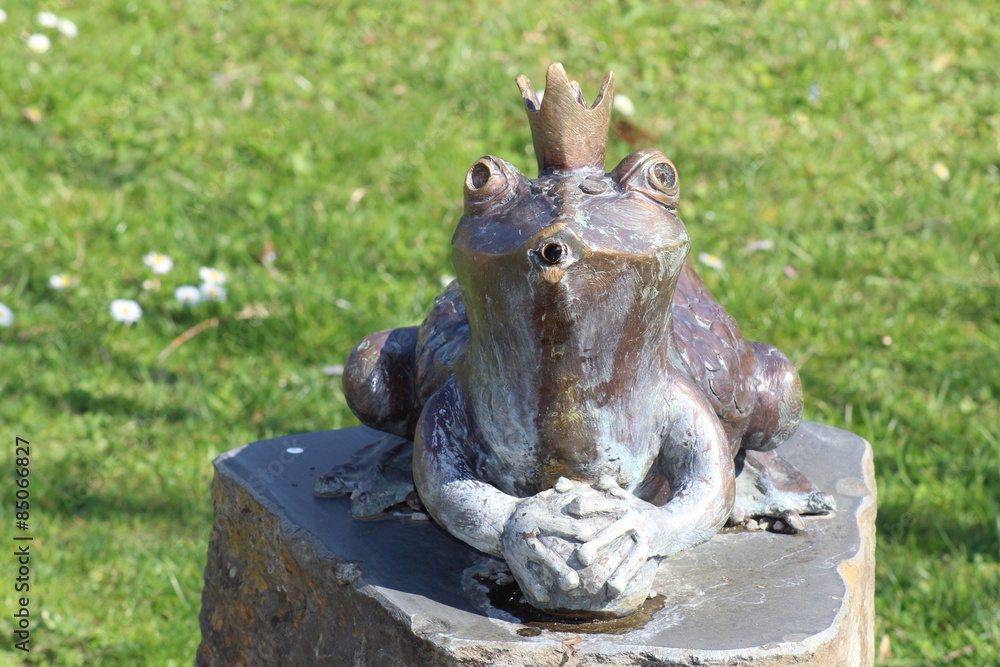 A fountain of frog sculpture in Botanical Garden in Innsbruck, Austria A fountain of frog sculpture in Botanical Garden in Innsbruck, Austria