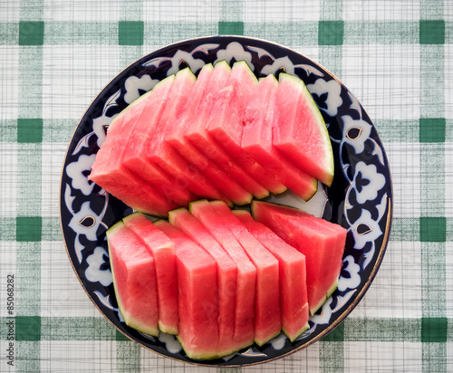 Ripe watermelon slices on oriental plate