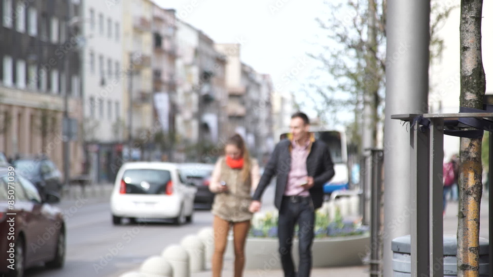 woman and man with mobile phone in the city woman and man with mobile phone in the city