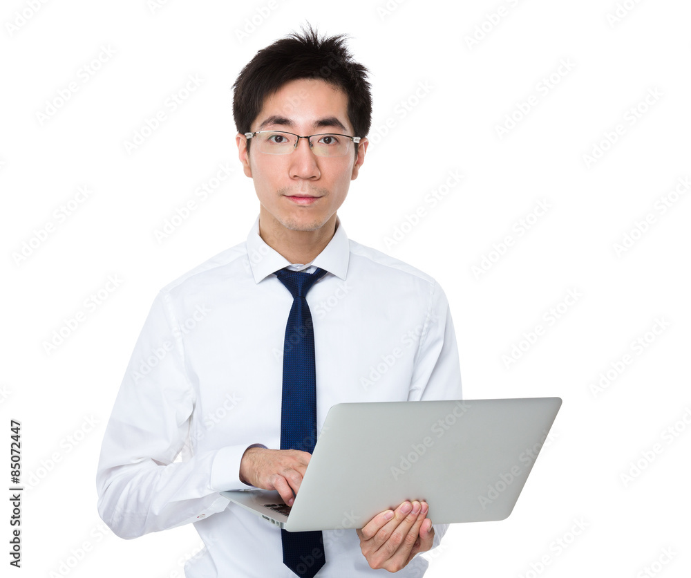 Young businessman use of laptop computer Young businessman use of laptop computer