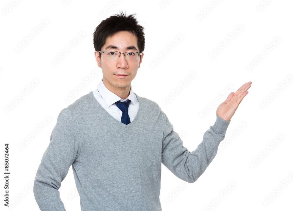 Young businessman with hand showing something Young businessman with hand showing something