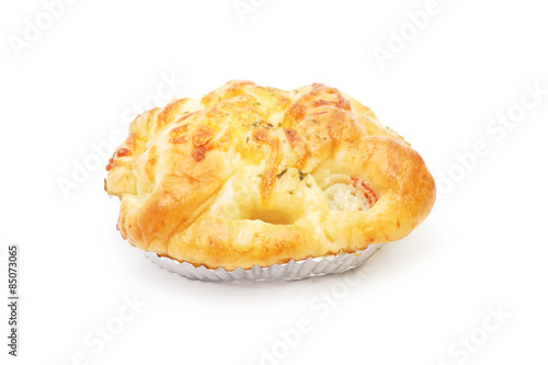 sweet bread on foil on white background