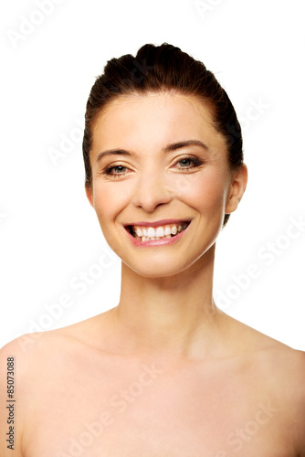 Beautiful toothy smiling woman with make up.