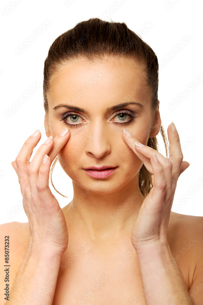 Spa woman with make up touching her face. Spa woman with make up touching her face.