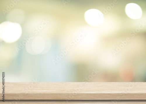 Empty table and blurred store with bokeh background photo