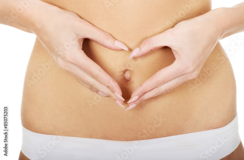 Wallpaper Mural Woman makes heart on belly. Torontodigital.ca