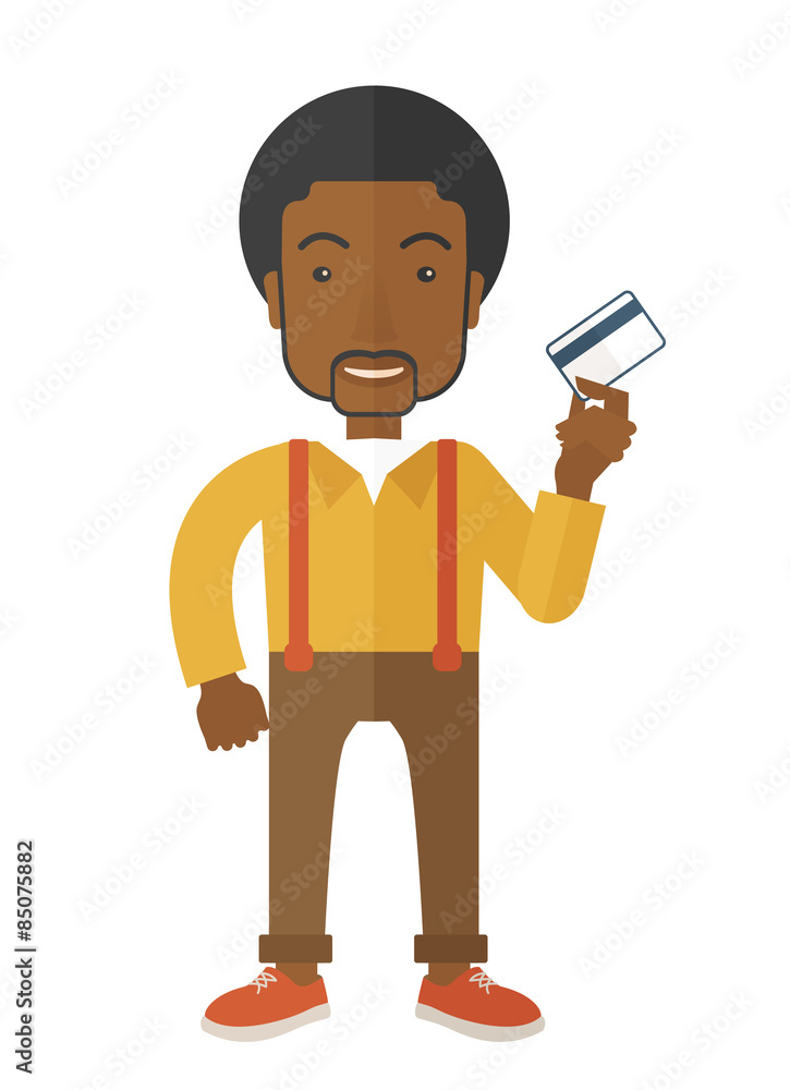 Happy businessman standing holding credit card.