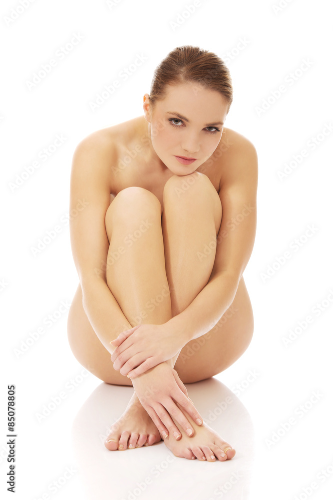Spa woman sitting with her knees close to chest. Spa woman sitting with her knees close to chest.