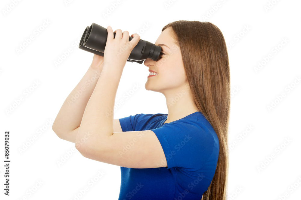 Young woman with binoculars. Young woman with binoculars.
