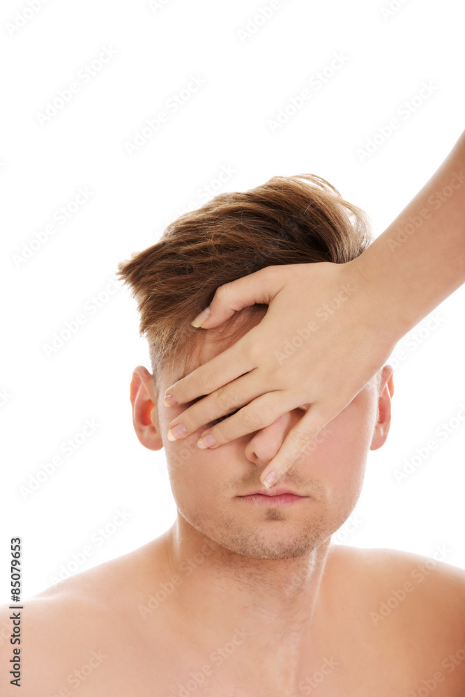 Woman's hand covering man's eyes. Woman's hand covering man's eyes.