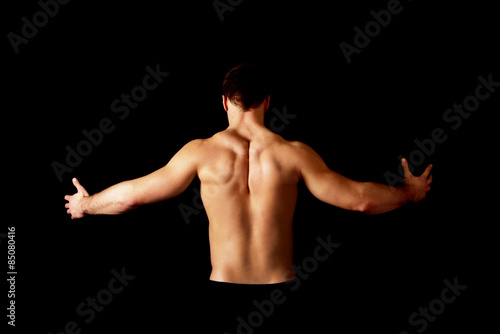 Sexy muscular man showing his muscular back.