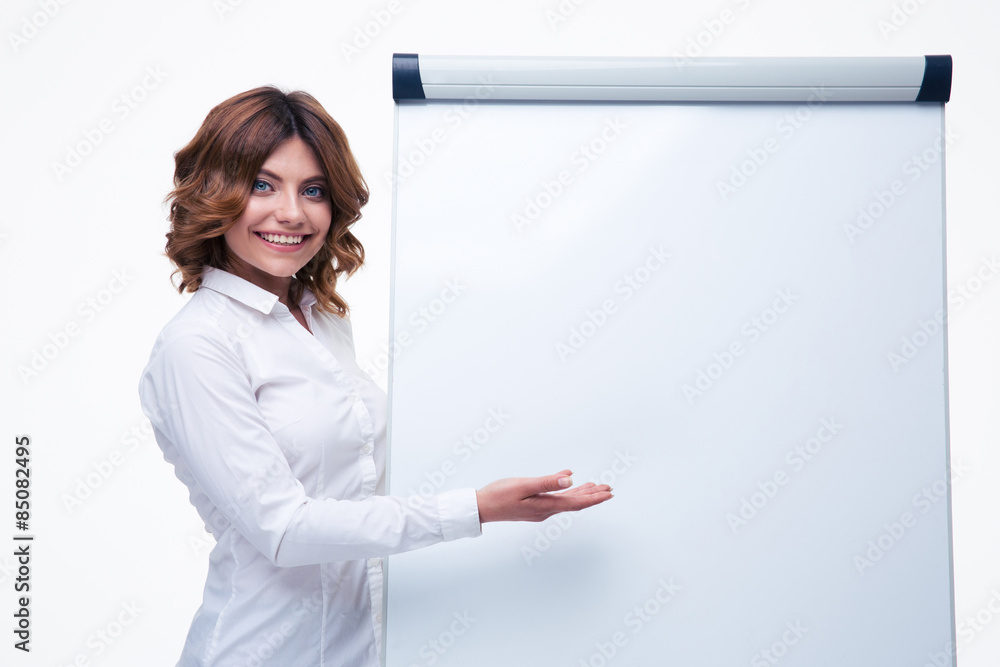 Businesswoman presenting strategy on flipchart Businesswoman presenting strategy on flipchart