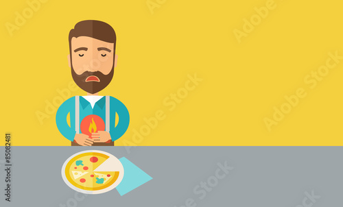 Man has a stomach burn or abdominal pain after he ate pizza.