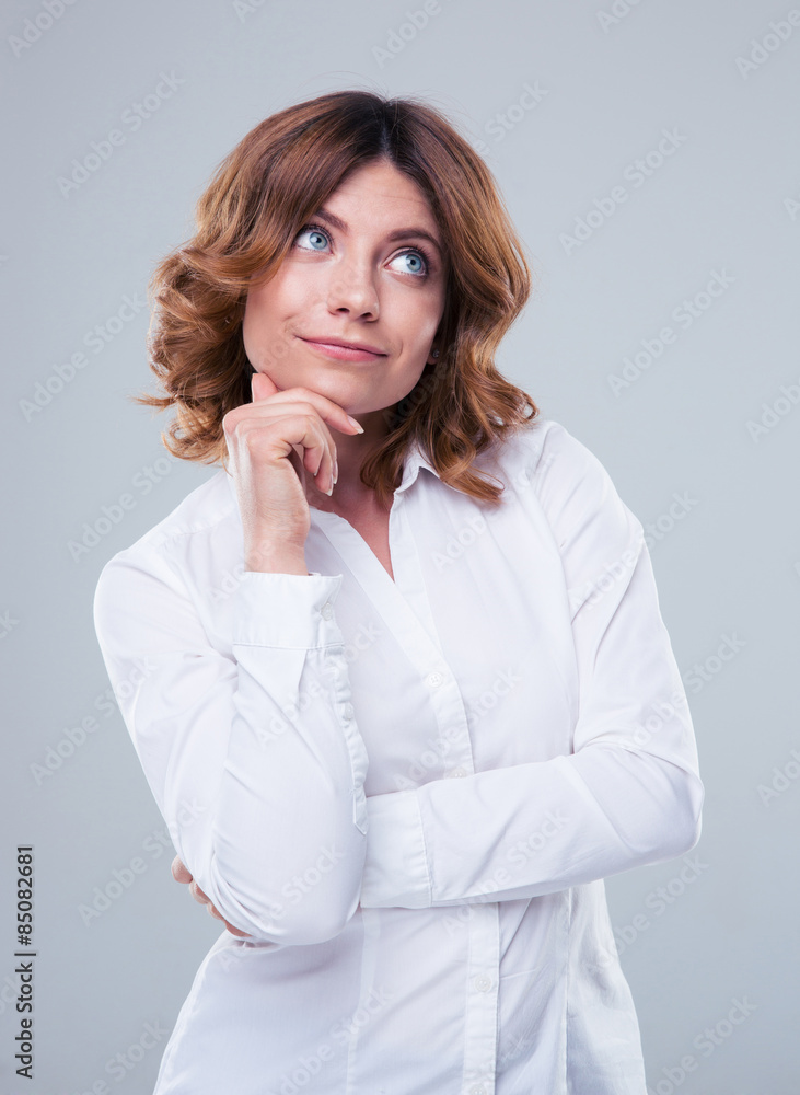 Portrait of a thoughtful businesswoman looking up Portrait of a thoughtful businesswoman looking up