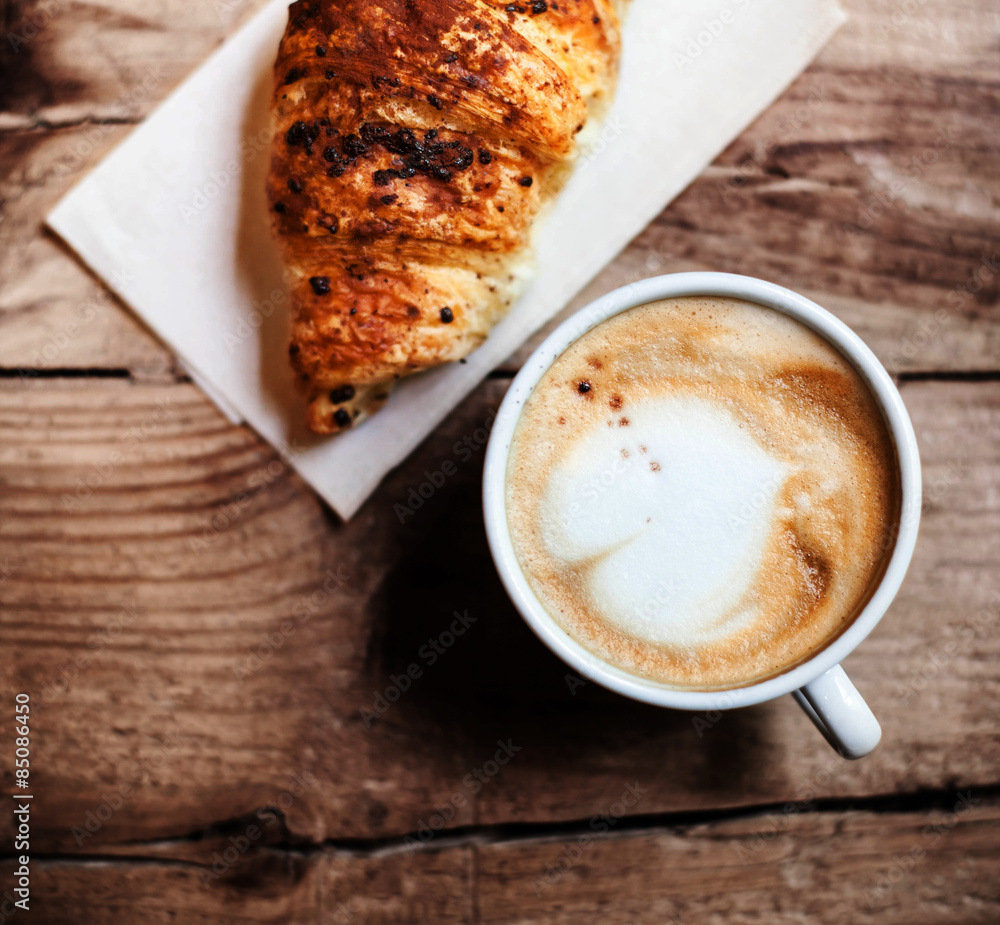 Coffee and fresh croissant for breakfast on rustic wooden table, Coffee and fresh croissant for breakfast on rustic wooden table,