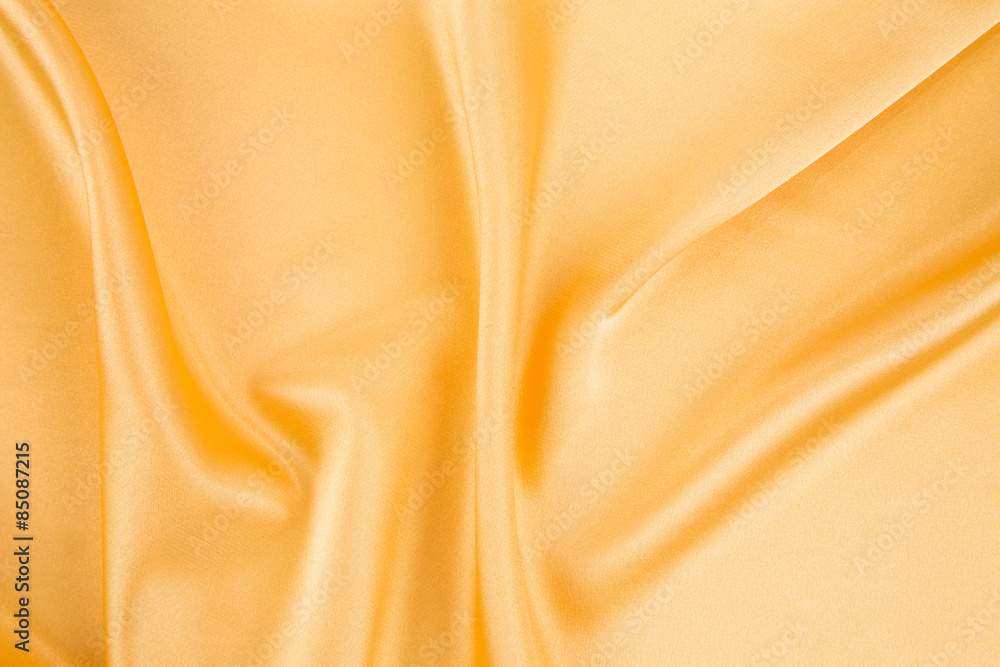 Fototapeta premium Close up of yellow silk cloth texture.