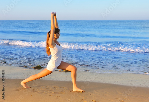 Healthy woman doing exercising on the beach, girl doing sport ou