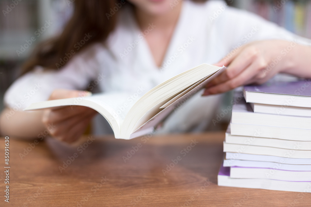 Beautiful asian female student portrait and books in library wit Beautiful asian female student portrait and books in library wit