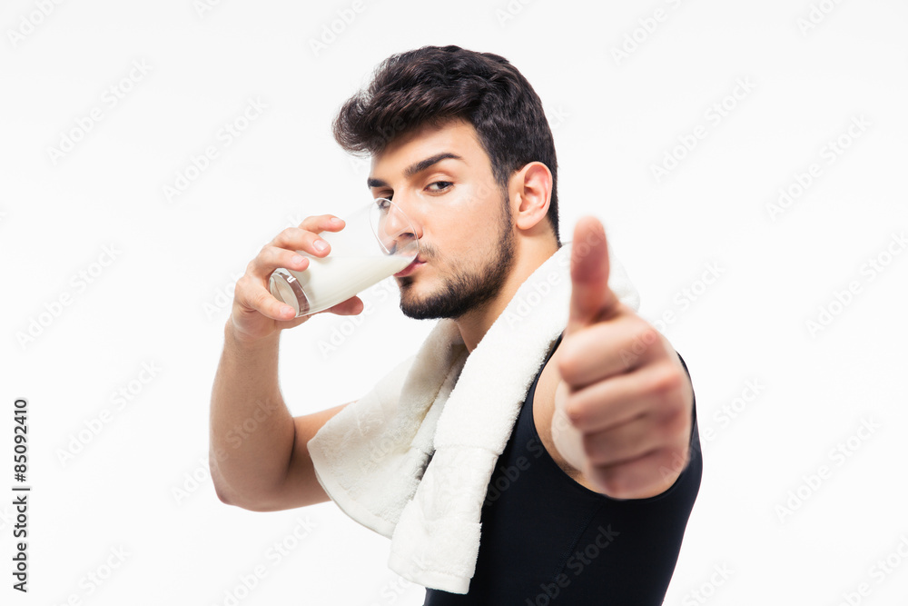 Fitness man drinking milk