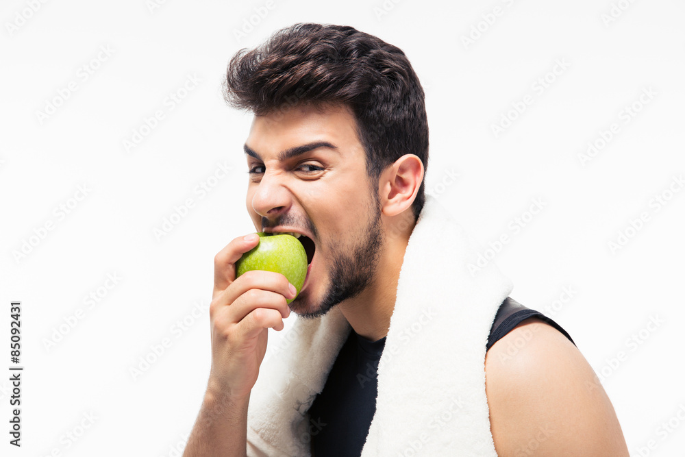 Fitness man eating apple Fitness man eating apple