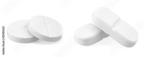 Two pills isolated on white background.