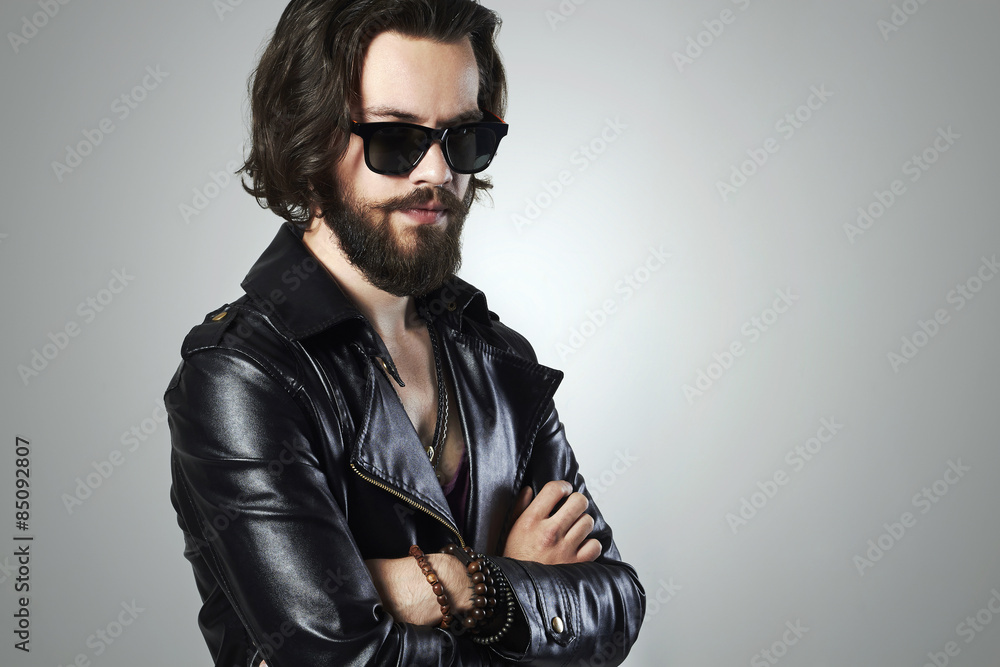 handsome man in leather.Brutal bearded Sexy boy in sunglasses handsome man in leather.Brutal bearded Sexy boy in sunglasses