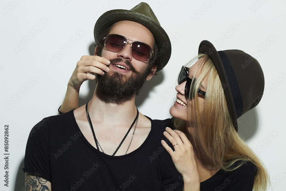 fashion beautiful happy couple in hat.Hipster boy and girl Stock Photo |  Adobe Stock